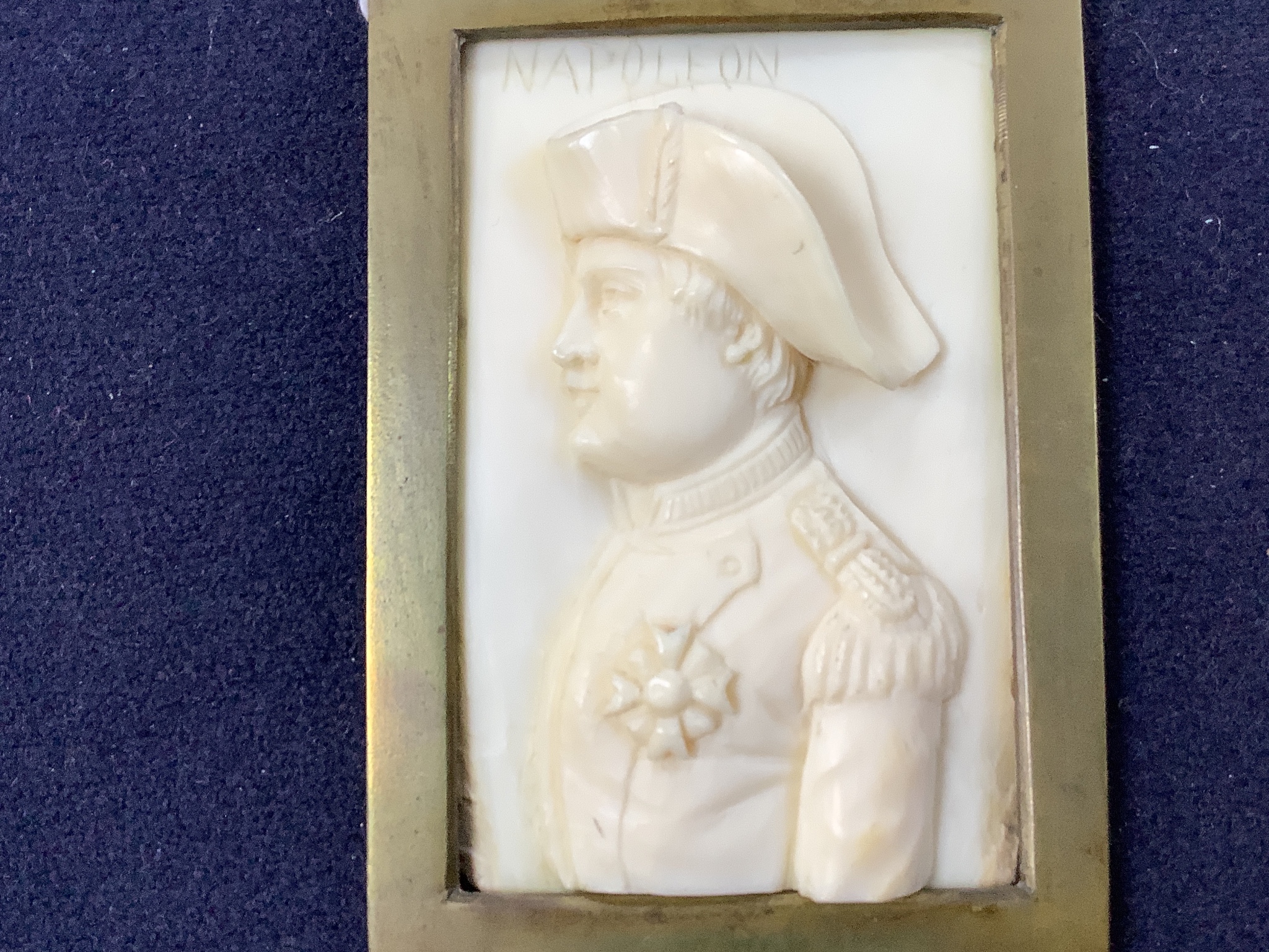 A pair of 19th century carved ivory portrait reliefs, Napoleon and Louis XVIII, 6 x 8.5cm